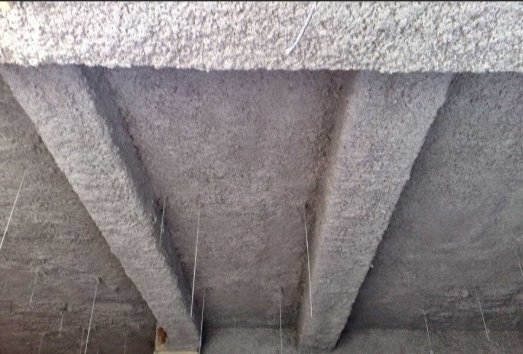 Flocage coupe-feu projection laine minérale plafond parking souterrain protection incendie REI isolation thermique acoustique Lyon copropriété immeuble syndic entreprise certifiée RGE Qualibat oneiso.fr